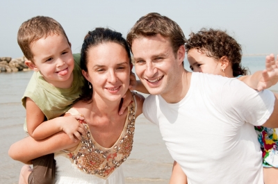Family in the beach with affirmations