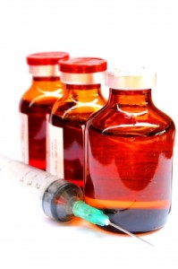 Vaccines in bottles with syringe